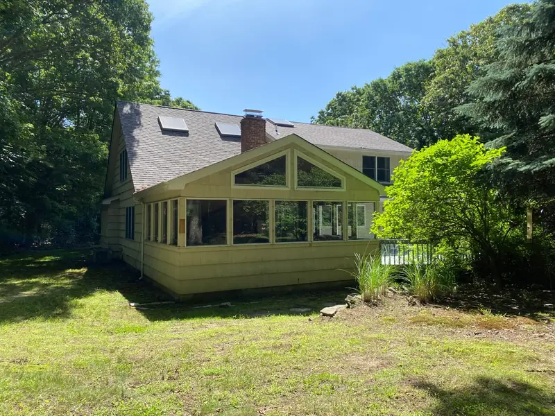 Glassed sunroom on the back of a Cape, Smithtown, NY