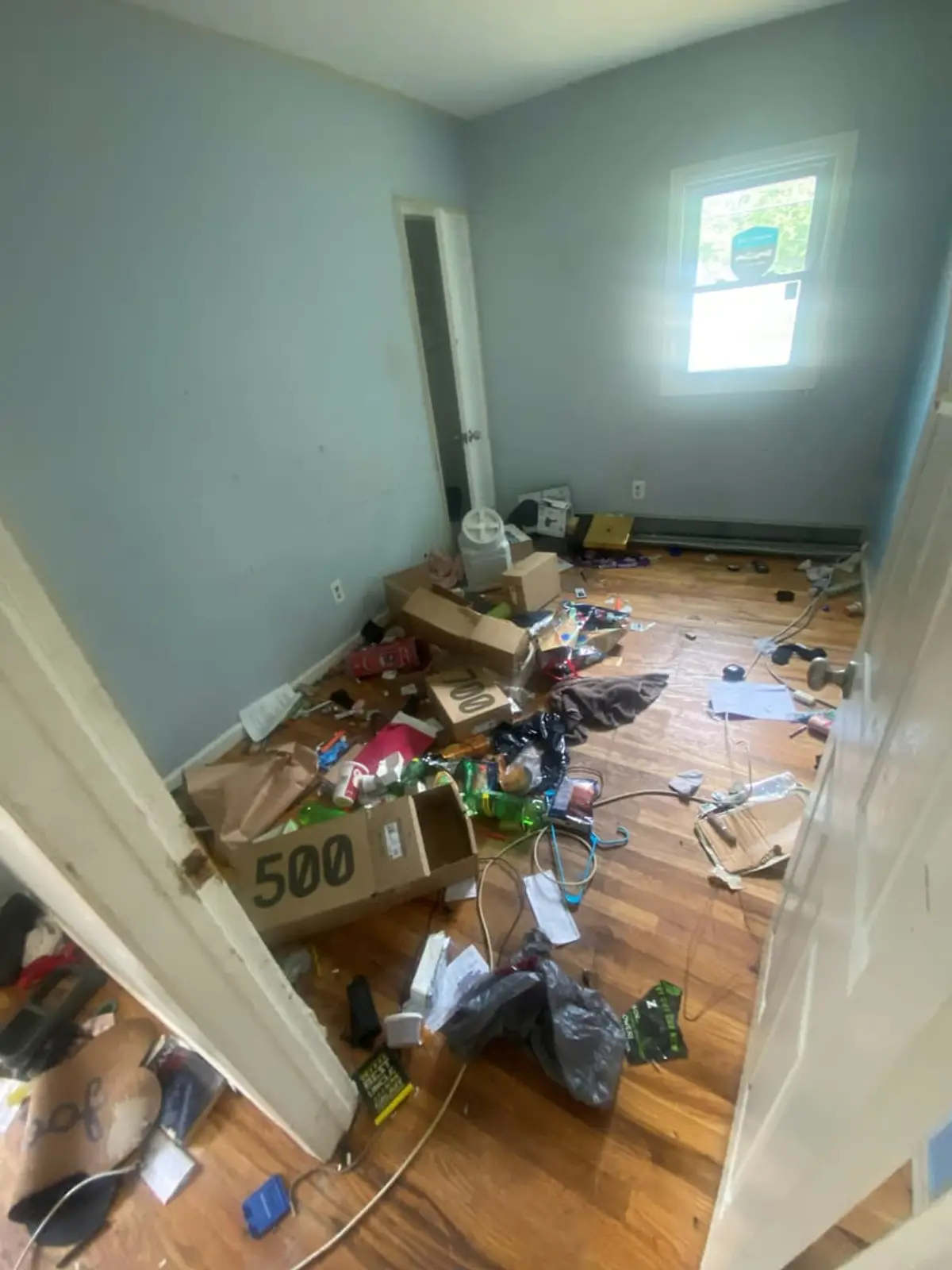 Selling a house as-is in Smithtown: rotted porch enclosure with its front wall gone
